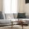 a grey couch with pillows